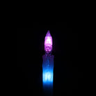 A flowlight is glowing, half of it is purple and half is blue, it looks bright.