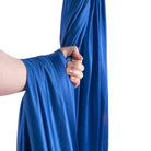 Royal blue yoga hammock wrapped around hand