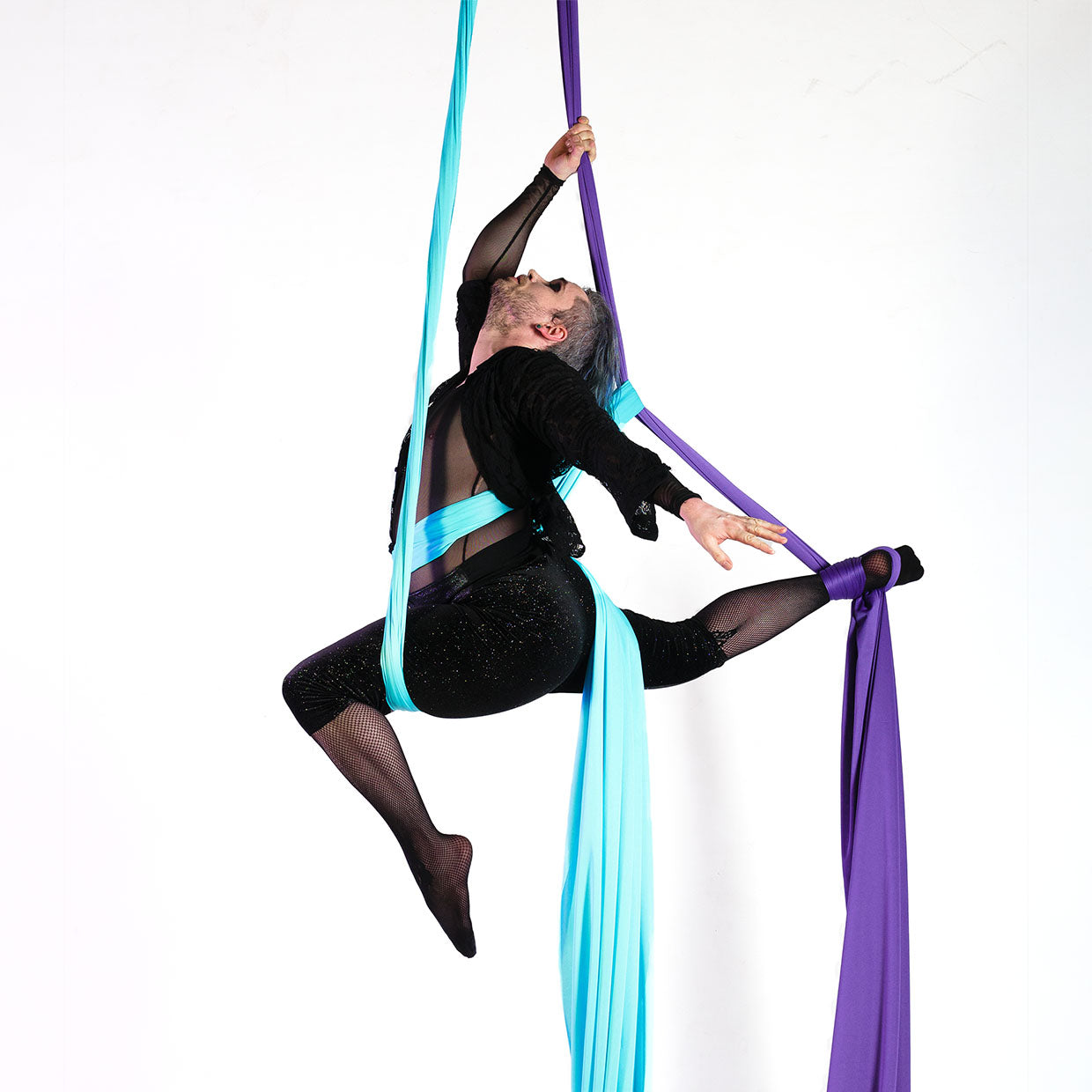 performer in dual colour silks