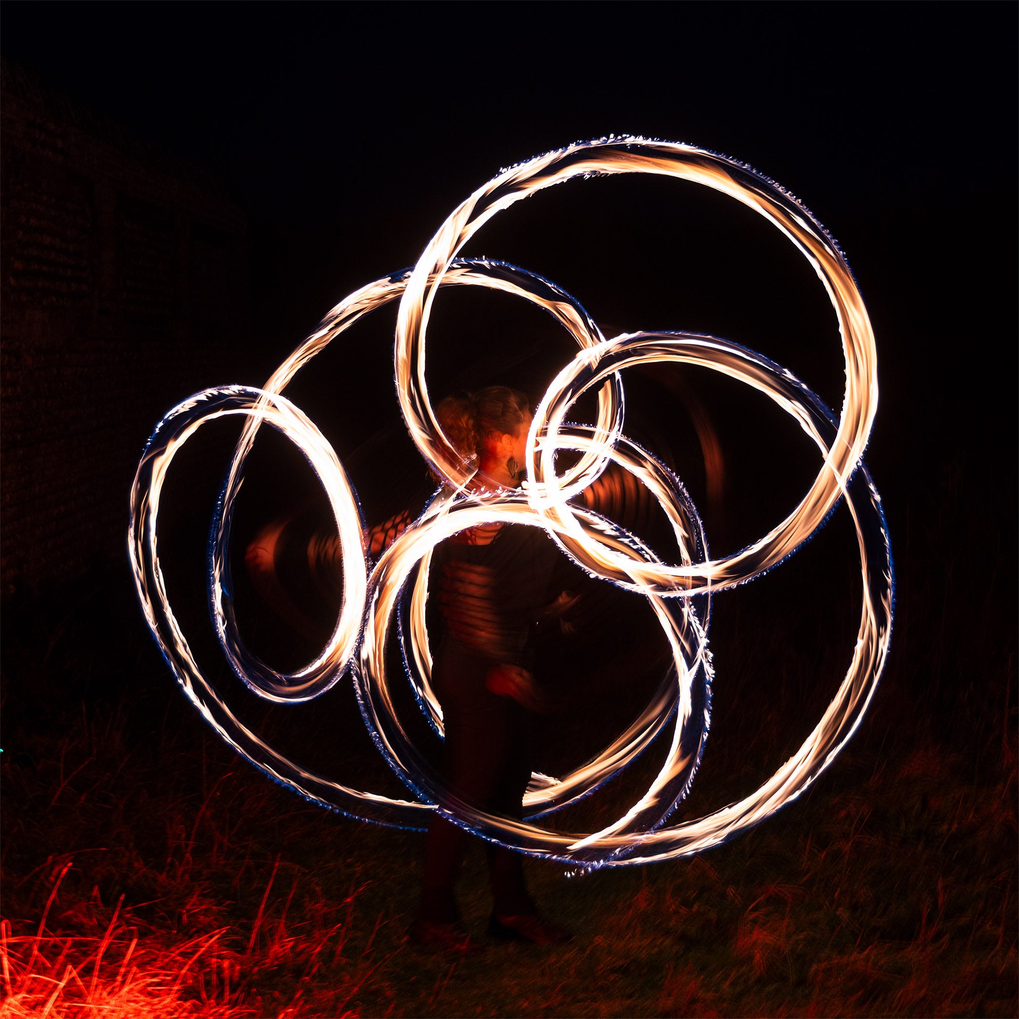 performer with fire poi