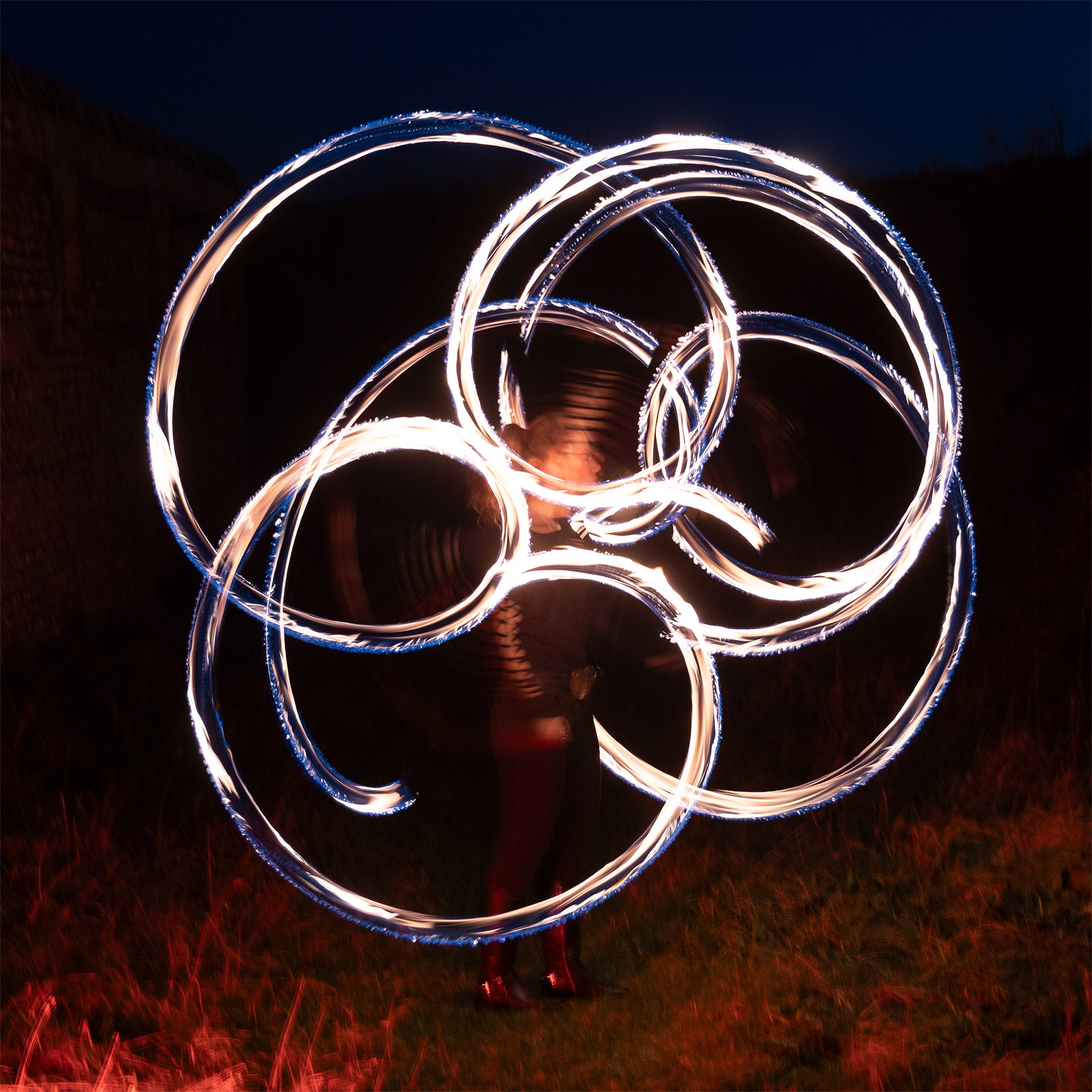 performer with fire poi