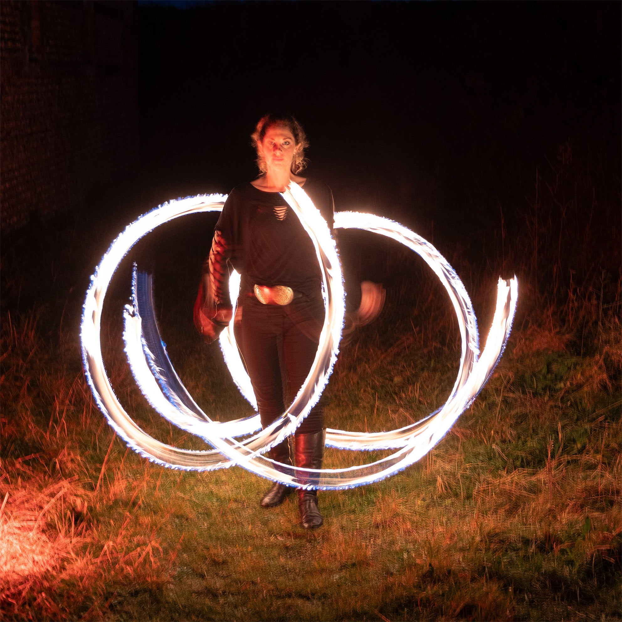 performer with fire poi