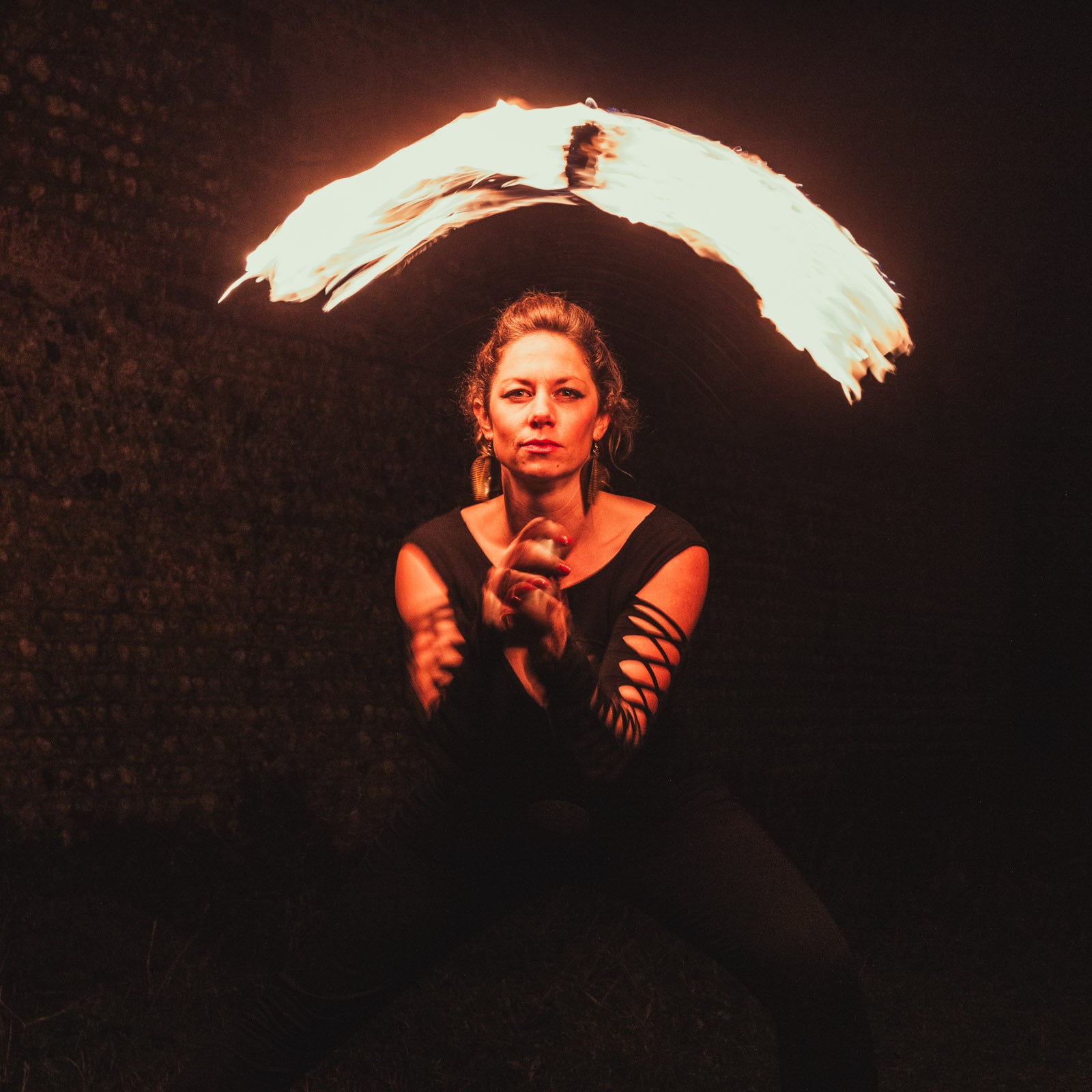 performer with fire poi