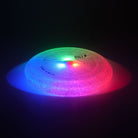 lighting bolt disc glowing red, blue and green on black background