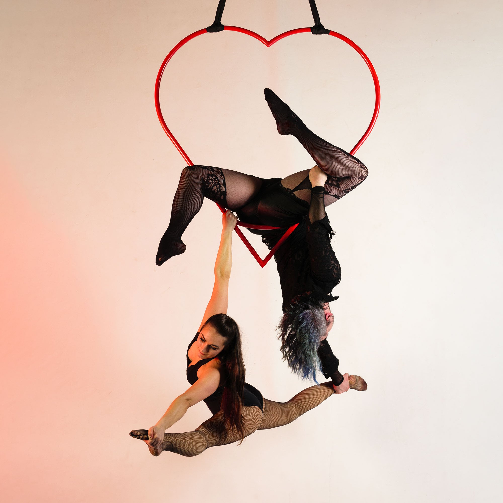 doubles performance with an aerial heart hoop