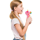 squeeze popper pink unicorn being held